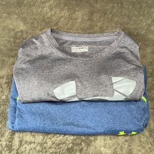 Two Under Armour short sleeve athletic  shirts.